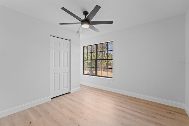 unfurnished room featuring light hardwood / wood-style flooring and ceiling fan