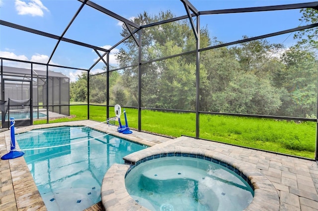 view of pool featuring an in ground hot tub, a patio, and glass enclosure