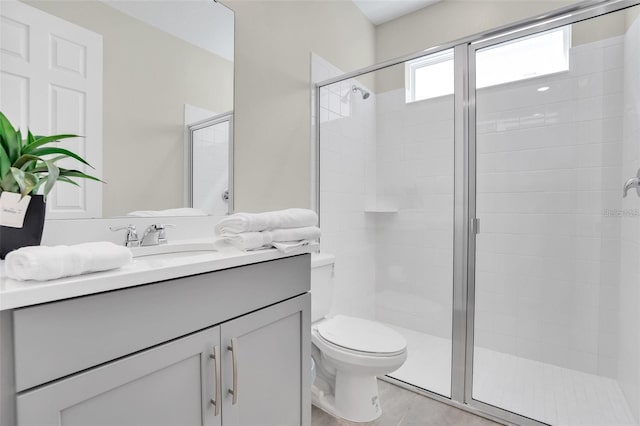 bathroom with vanity, toilet, and walk in shower