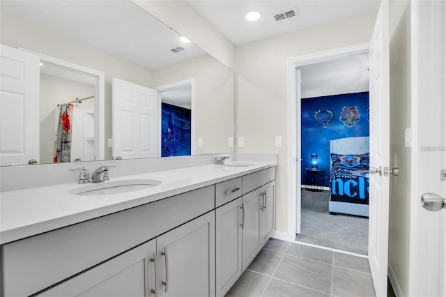 bathroom with vanity and tile patterned floors