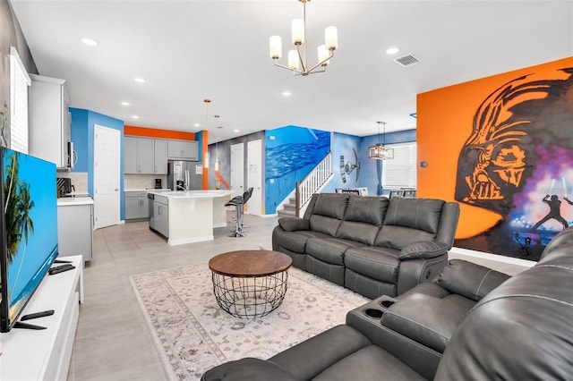 living room featuring a chandelier