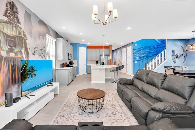 living room with recessed lighting and a notable chandelier