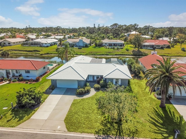 birds eye view of property featuring a water view