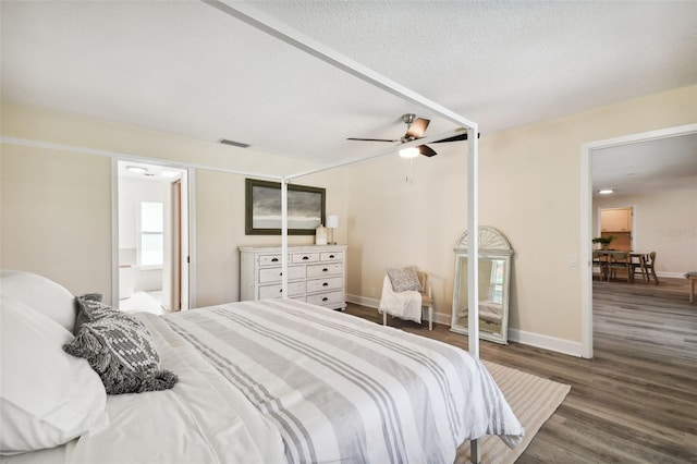 bedroom featuring a textured ceiling, ceiling fan, dark hardwood / wood-style flooring, and ensuite bathroom