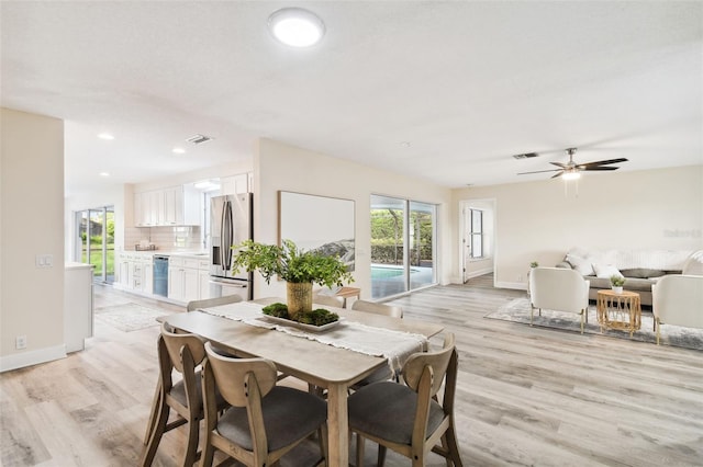 dining room featuring ceiling fan and light wood-type flooring