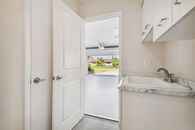 clothes washing area with sink