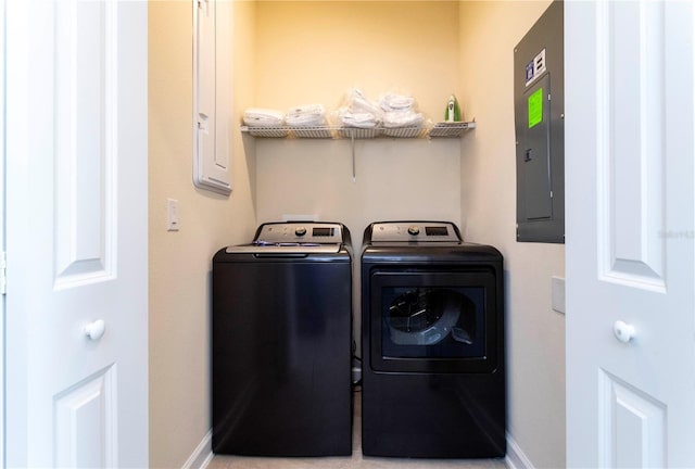 washroom with washing machine and dryer and electric panel