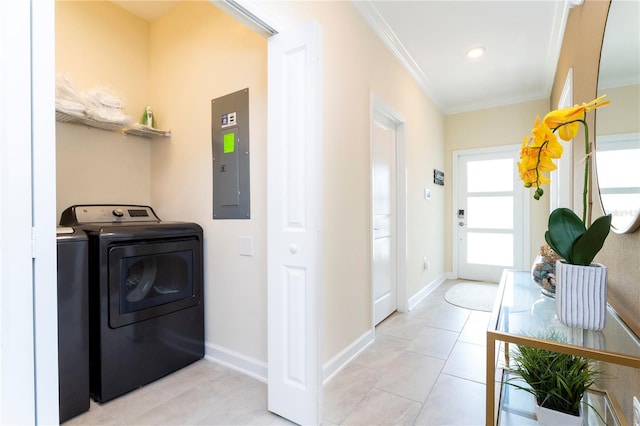 laundry room featuring electric panel, washer and clothes dryer, ornamental molding, and light tile patterned flooring