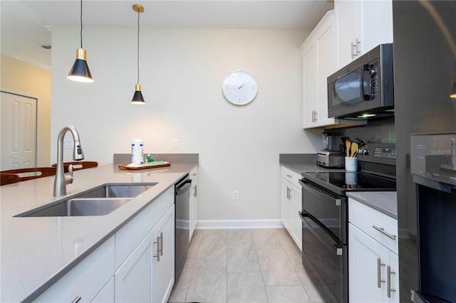 kitchen featuring backsplash, sink, black appliances, pendant lighting, and white cabinetry