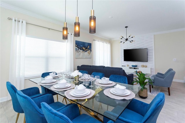 dining area with ornamental molding and a notable chandelier