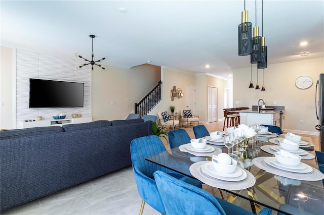 tiled dining area with a notable chandelier and sink