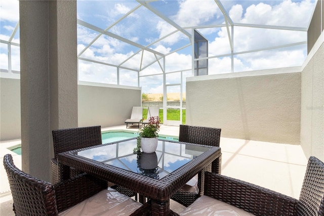 view of patio / terrace with a lanai