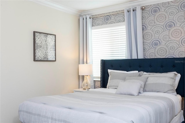 bedroom with multiple windows and ornamental molding