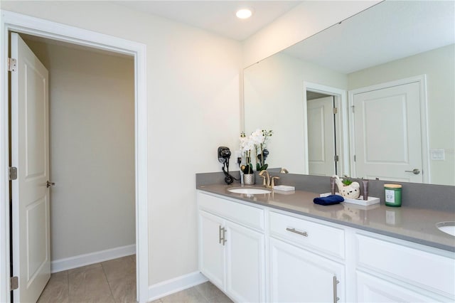 bathroom with tile patterned floors and vanity