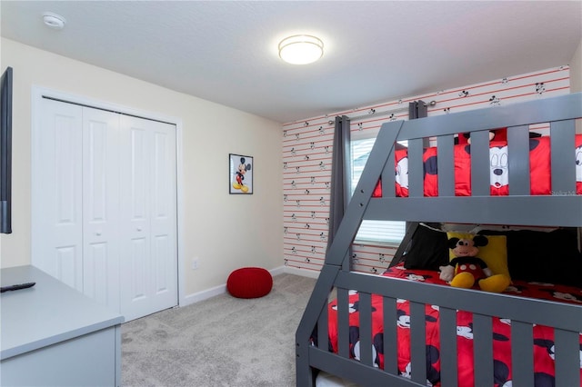 bedroom with carpet flooring and a closet