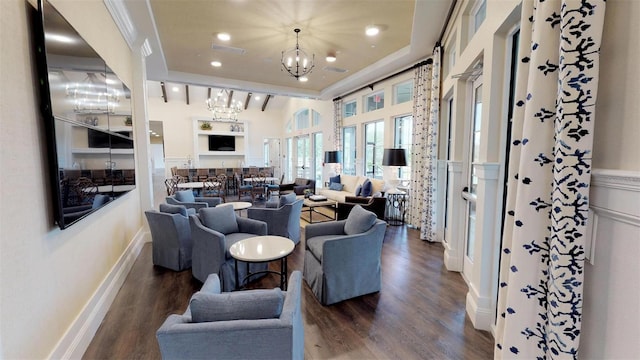 living room with dark wood-type flooring and a notable chandelier