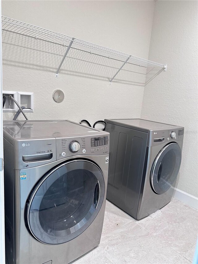 laundry room with washing machine and dryer