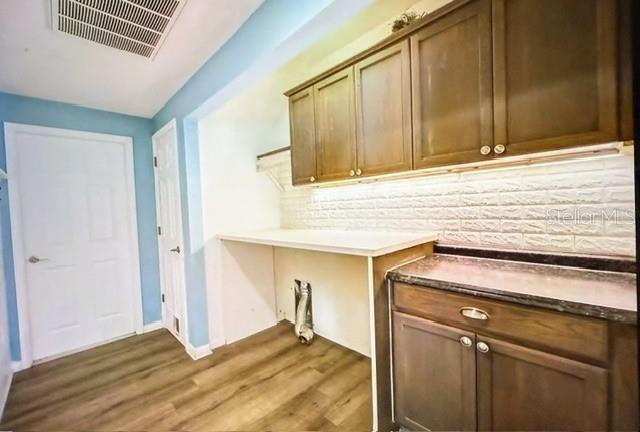 washroom with dark wood-type flooring