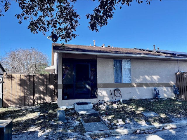 view of front of home featuring solar panels