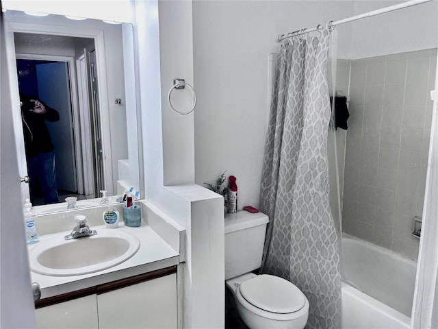 bathroom with shower / tub combo, toilet, and vanity