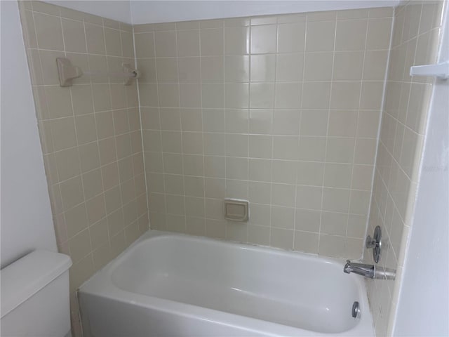 full bathroom with bathing tub / shower combination and toilet