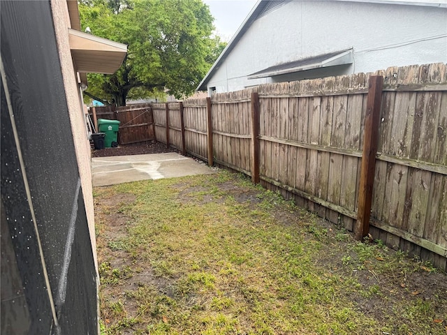 view of yard featuring a patio and a fenced backyard