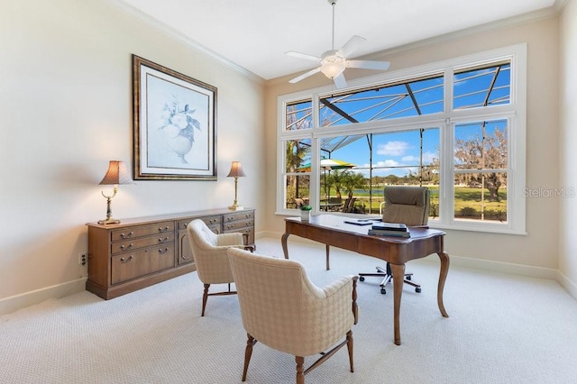 office area featuring light carpet, ceiling fan, and crown molding