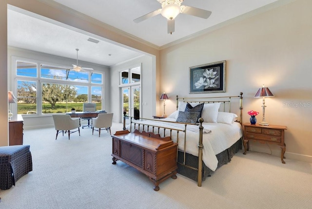 carpeted bedroom featuring ceiling fan and crown molding