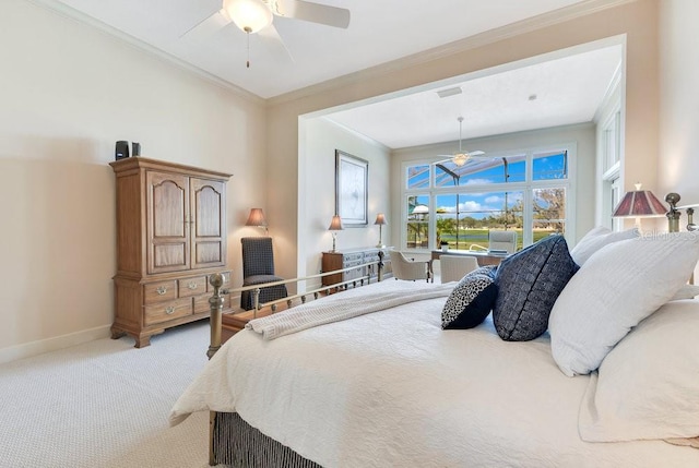 carpeted bedroom featuring ceiling fan and ornamental molding