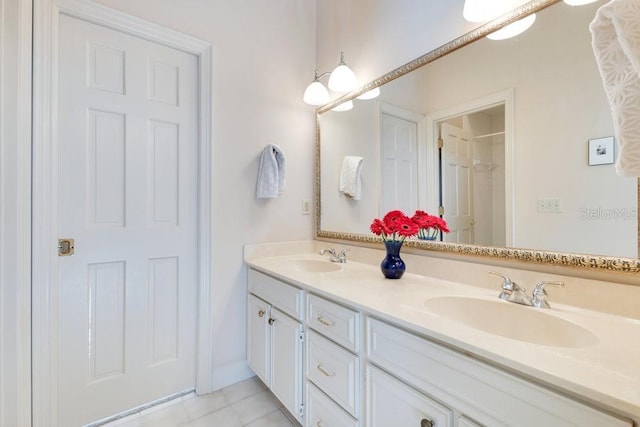 bathroom with vanity and tile patterned flooring