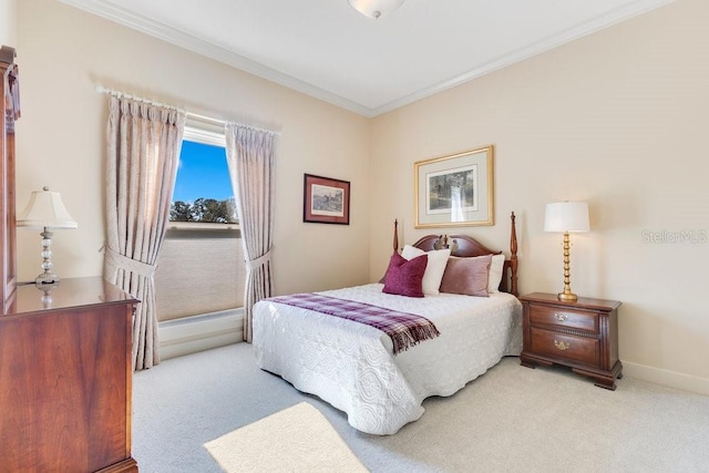 bedroom featuring ornamental molding and light colored carpet