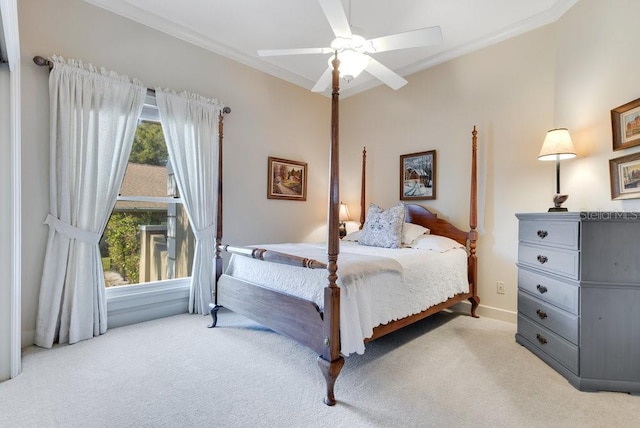 bedroom featuring ceiling fan, crown molding, and light carpet