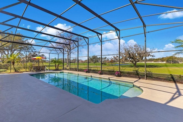 view of pool featuring a patio and glass enclosure