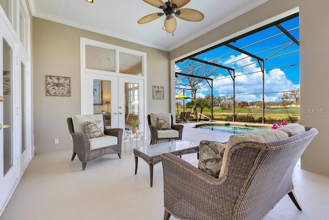 view of patio / terrace with a lanai, ceiling fan, outdoor lounge area, and french doors