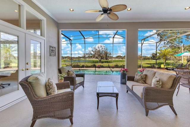 sunroom featuring ceiling fan, a swimming pool, and french doors