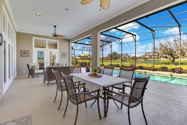 view of patio / terrace with ceiling fan, glass enclosure, and french doors