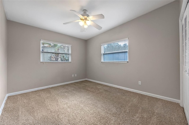 carpeted empty room with ceiling fan