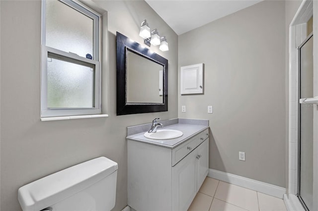 bathroom with toilet, an enclosed shower, vanity, and tile patterned floors