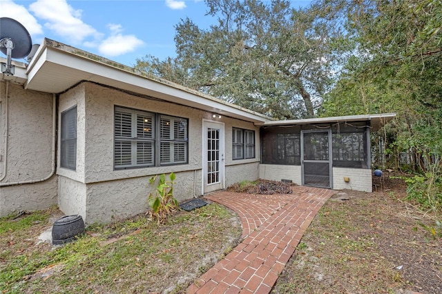 exterior space featuring a sunroom