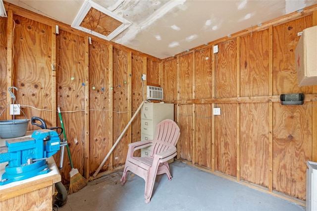 storage room featuring an AC wall unit