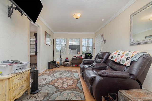 living room with cooling unit, crown molding, and light wood-type flooring