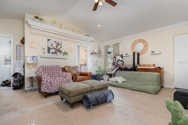 carpeted living room with ceiling fan, crown molding, washer / dryer, and lofted ceiling