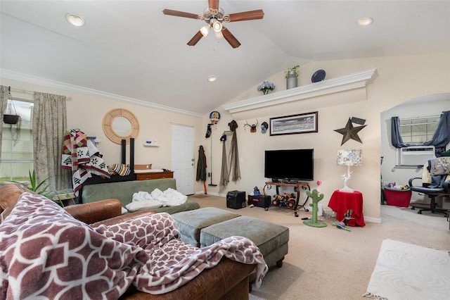 carpeted living room with vaulted ceiling, ceiling fan, ornamental molding, and plenty of natural light