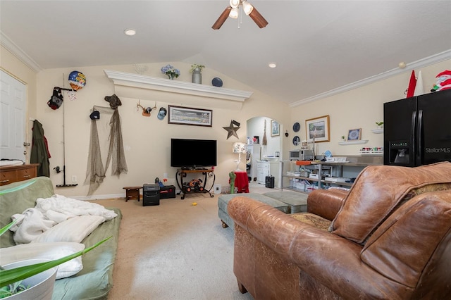 carpeted living room with ceiling fan, ornamental molding, and vaulted ceiling