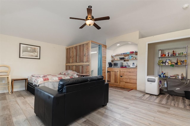 bedroom featuring ceiling fan and light hardwood / wood-style floors