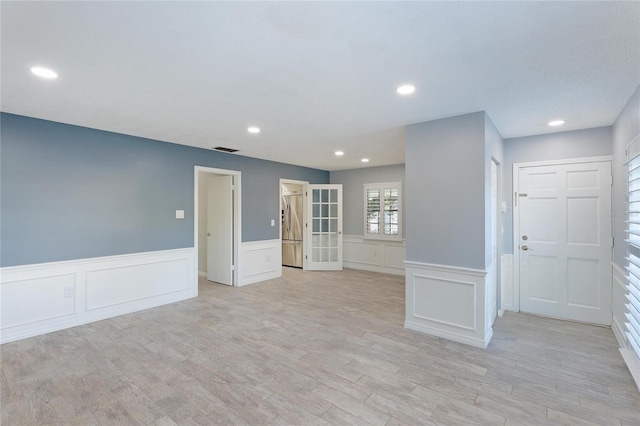 unfurnished room featuring light wood-type flooring