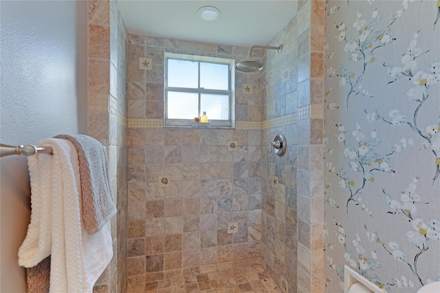 bathroom with tiled shower