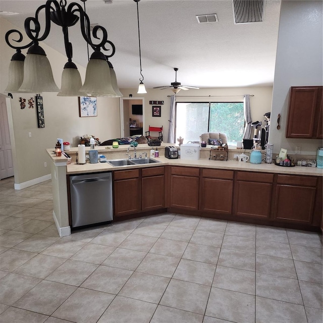 kitchen with sink, stainless steel dishwasher, light tile patterned floors, ceiling fan, and kitchen peninsula