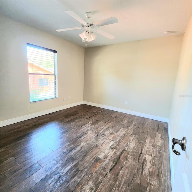 unfurnished room with ceiling fan and dark hardwood / wood-style floors