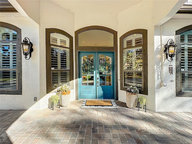 property entrance featuring french doors